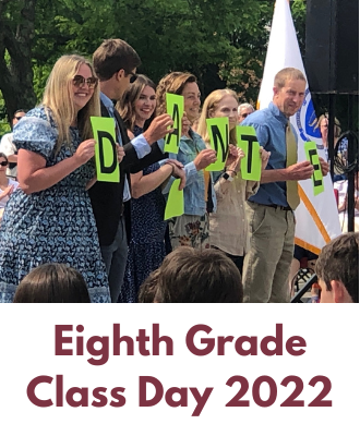  teachers at class day holding signs 